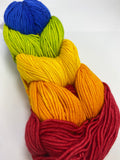 5 mini skeins of worsted weight yarn linked together to resemble a braid.  The skeins are dark pink, bright orange, bright yellow, neon green, and bright blue.