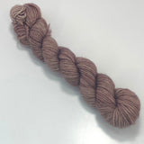 A mini skein of tonal warm taupe yarn. 