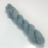 A miniskein of light blue yarn. 